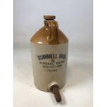 A stoneware flagon marked Scamell Bros Mineral Water Manufacturers, Frome W:23cm x H:42cm