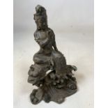 A Chinese hollow metal figure of the Bodhisattva seated on a lion W:19cm x H:30cm