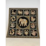 A Thai Kalaga astrology tapestry with central elephant and twelve signs of the Thai zodiac.