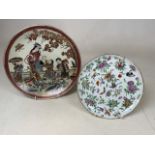 A 19th century porcelain plate decorated with birds and butterflies. Wear to gilt rim chip to one