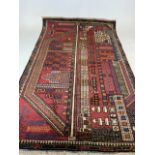 An old Baluchi rug. W:140cm x H:85cm
