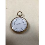 A brass aneroid pocket barometer W:5cm