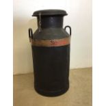 A vintage milk churn with Exeter and Hammetts Dairies Ltd highlighted in red W:35cm x H:70cm