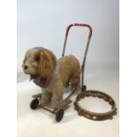 A vintage St Bernard dog on wheels - well loved also with a tambourine A/F