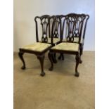 A set of four chippendale style good quality reproduction dining chairs with ball and claw feet.