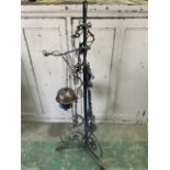 A large wrought iron and copper converted oil lamp. Approximately H:135cm