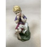 A royal Worcester Freda Doughty figure of June 3456 of boy with dog. Boy has purple shirt and red