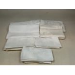 A quantity of damask table cloths and napkins.