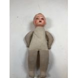 Vintage doll with glass eyes and teeth with soft fabric body. 17 inches . Hole to front of head