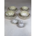 Belleek porcelain decorated in the Shamrock pattern - 4 soup cups and saucers, a mustard pot and a