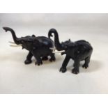 Two ebony elephants. Tallest 18cm to top of trunk