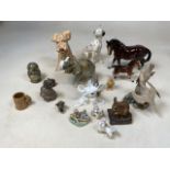 A quantity of ceramic animals in including a Royal Dux elephant, a Trentham horse, a Sylvac dog, a