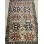 A Persian Ardebil rug with Aztec influence. W:131cm x H:220cm