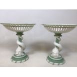 A pair of Minton dolphin fruit stands with pierce work tops. Small crack to top of one W:23cm x