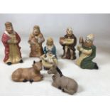 A painted ceramic nativity scene - 9 figures H:15cm Tallest figure