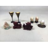 Three painted Chinese eggs on stands together with a Bisque Chinese Buddah, Chinese Foo dogs and a
