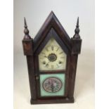A Gothic style steeple clock with painted glass door W:25cm x D:9cm x H:50cm