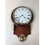 A Comitti quartz clock with a mahogany drop dial case with book matched curl mahogany veneers W:26cm