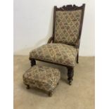 A Victorian low upholstered nursing chair on brass castors also with an upholstered stool. Seat