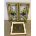 A pair of stained glass windows and frames and another. W:35cm x H:78cm