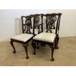Four mahogany Chipendale style dining chairs with ball and claw feet to include one carver. (A.F)