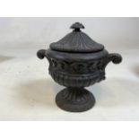 A Cast iron lidded tobacco urn with rose finial W:20cm x H:20cm