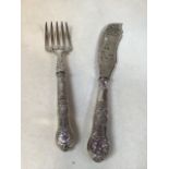 A pair of silver handled fish servers - worn hall marks