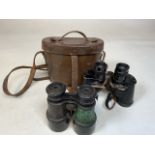 Pair of binoculars in leather case marked Bausch & Lomb together with a pair with rotating lens