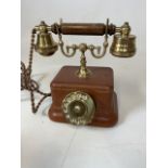 A reproduction leather covered telephone by Telcer.