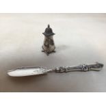 A silver pepperette and a silver knife total weight 76gm. Pepper hallmarked Birmingham 1924 and