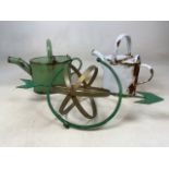 A green and gold armillary garden sun dial (A.F no base) also with two enamel watering cans.