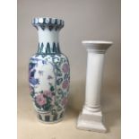 A tall oriental vase decorated with peacocks and birds A/F also with a white ceramic pedestal W:24cm
