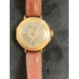A heart shaped ladies 9ct wristwatch on leather strap.