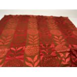 Am pair of unlined mid century curtains in woven jacquard fabric red with rust floral design. Fabric