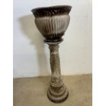 A West German pottery jardiniere on stand. H:82cm
