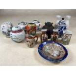 A collection of oriental ceramics, lidded ginger jars etc.