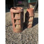 Two clay louvre chimney pots one stamped Sankeys. Tallest H:68cm