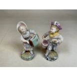A pair of continental figures of a boy and girl playing drums and accordion H:14cm