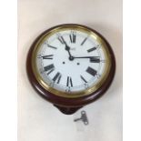 A Comitti Eight day bell strike movement. 10 inch dial with enamel finish and lacquered brass