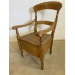 A late 19th early 20th century pine commode. Seat height H:43cm