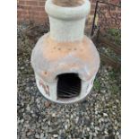 A two piece chimnea on stand. H:78cm