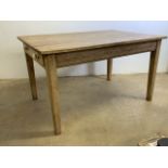 An Victorian pine country kitchen table on tapered legs, drawers either side with ceramic handles.