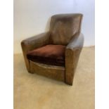 An Art Deco brown leather club chair with upholstered cushion. W:88cm x D:90cm x H:80cm