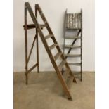 Two pairs of vintage step ladders.