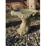 A small reconstituted stone bird bath H:38cm