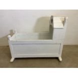 A white painted cot. W:92cm x D:53cm x H:78cm