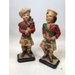 A pair of chalk ware Scottish Figures - a piper and a dancer H:40cm