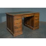 Edwardian oak twin pedestal desk. With 9 drawers and extension slides. 137 x 77 x 77cm tall W: