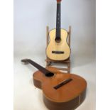 A half size guitar Height 79cm also with a full size guitar - no strings. No makers mark on small