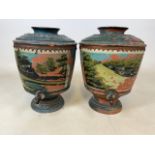 A pair of northern European decorative pottery urns with brass taps. H:43cm